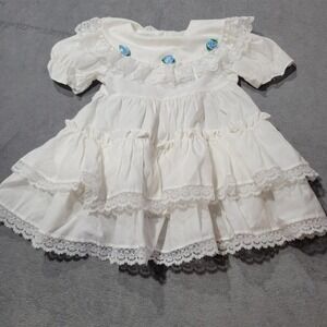 White Lace Tiered Baby Girl Dress with Blue Rosette Accents
